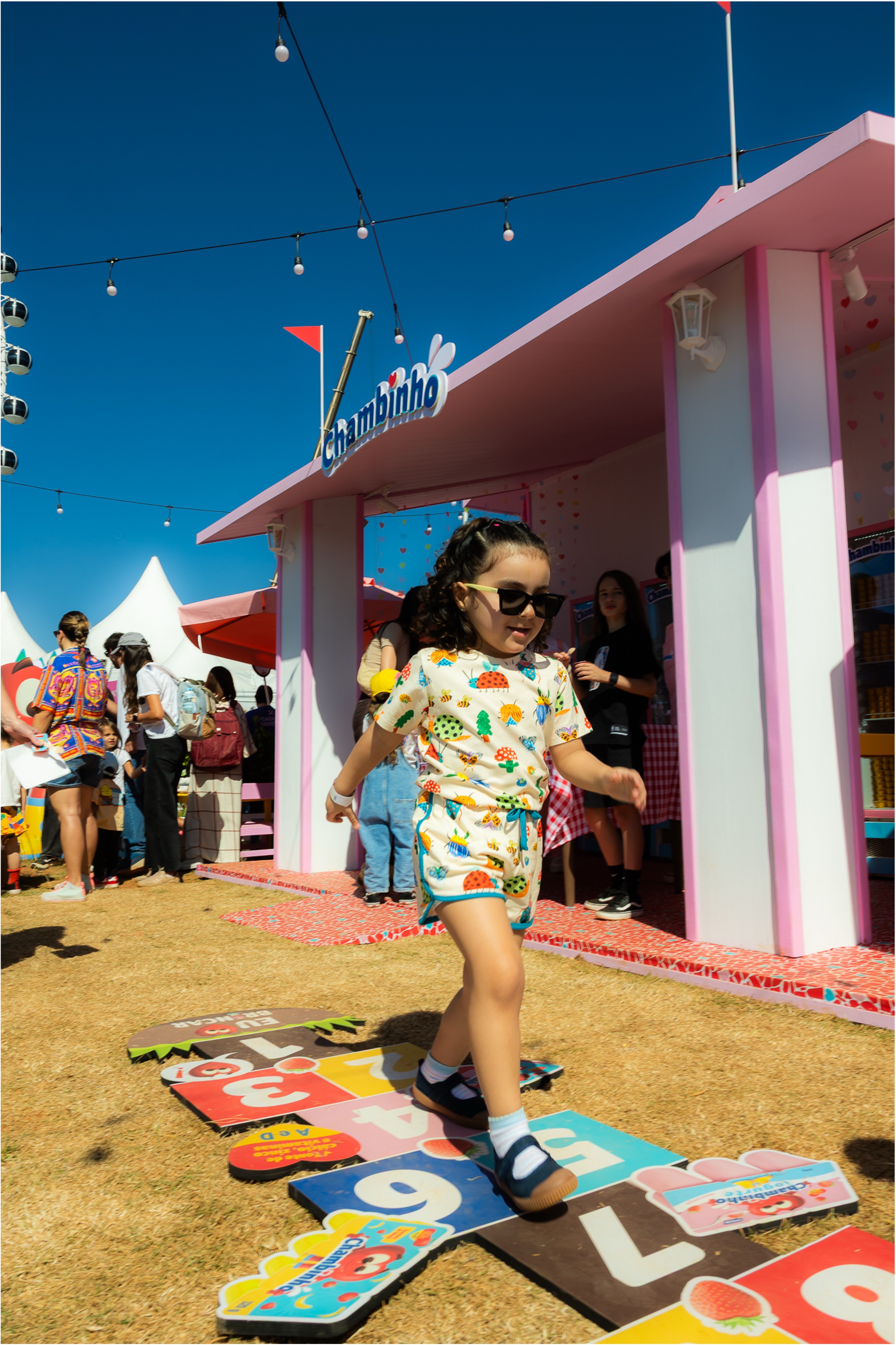 Child playing Chambinho hopscotch